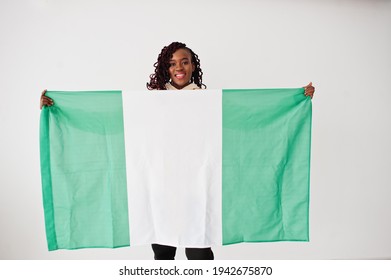 Nigerian Woman Hold Nigeria Flag Isolated On White Wall.