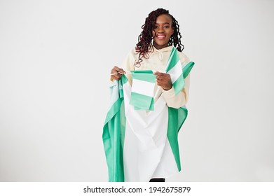 Nigerian woman hold Nigeria flag isolated on white wall.