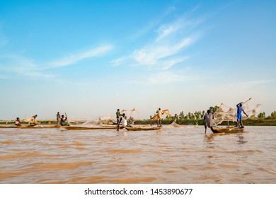 Nigerien fishermen fishing on their boats in Niger river during sunset in Niamey in Niger in Africa 25 June 2019