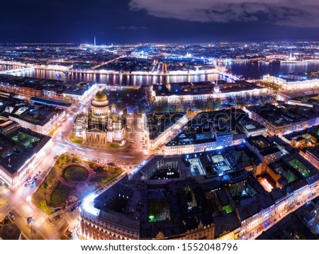 Night aerial panoramic view in Saint Petersburg, Russia. Illuminated st Isaac cathedral, Neva river, bridges and Peter and Paul fortress 