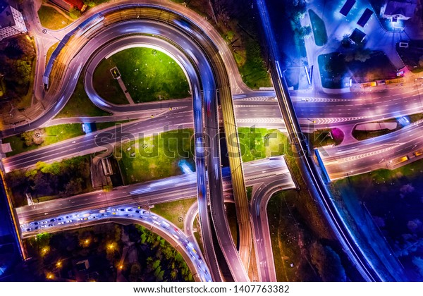 Night Aerial view of a freeway intersection\
traffic trails in night\
Moscow