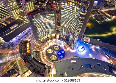 Night Aerial View Of A Modern Skyscraper In The Business District Of Milan