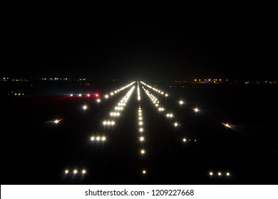 Night Airport Runway. Runway Lights And PAPI-lights.