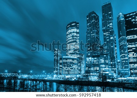 Night architecture - skyscrapers with glass facade. Modern buildings in Moscow business district. Concept of economics, financial. Copy space for text. Toned