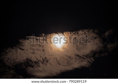 Similar – Image, Stock Photo Blood moon at total lunar eclipse, shining through trees