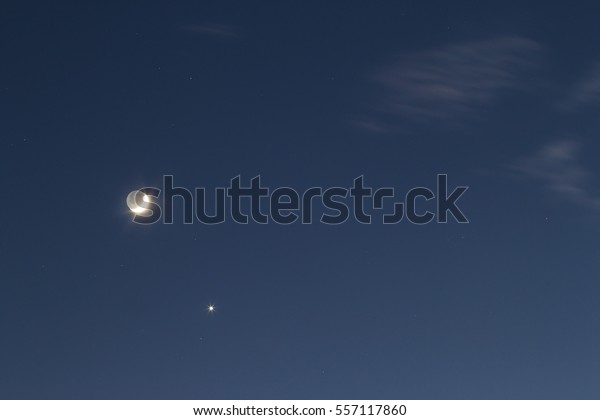 Night blue sky\
with bright moon and single\
star