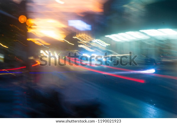 Night blurred
background with car lamp 
