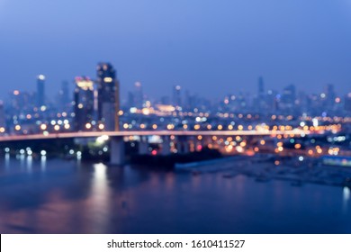 Night blurred bokeh light city office building, abstract background