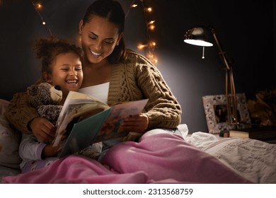 Night, book and mother with daughter in bedroom for storytelling, fantasy and creative. Education, learning and love with woman reading to young girl in family home for bedtime, literature and relax