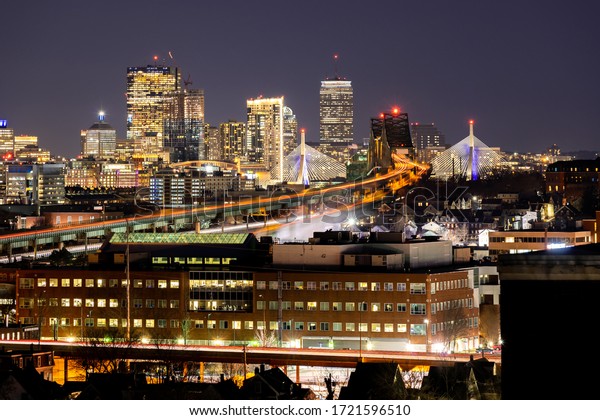 Night Boston Skycraper Skylines office downtown\
building with along Boston bay harbor at from Chelsea district.\
Boston is the capital city of the Commonwealth of Massachusetts in\
the United States