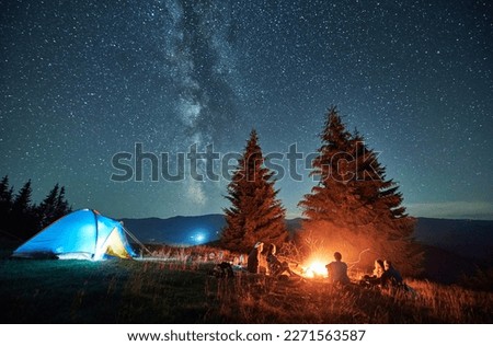 Similar – Image, Stock Photo People hiking at night. Mountains at sunrise. Man standing on peak. Natural mountain landscape with illuminated misty peaks, foggy slopes and valleys