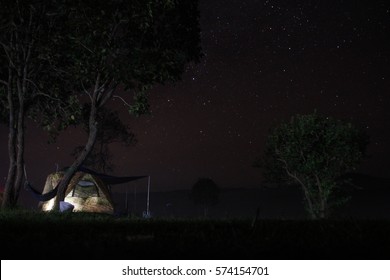 night camping tent in a national park with star sky
