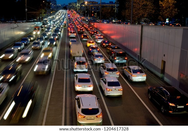 Night car traffic on the Garden ring\
street on departure from a tunnel in the center of\
Moscow
