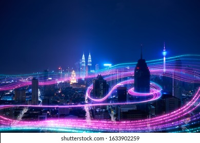 Night City And Abstract With Gradient Blue And Red Glowing Light Trail Surround The City ,Smart City Big Data Connection Technology Concept .