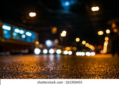 Night City After Rain, The Moon Over The Road On Which The Car Ride. View From Ground Level