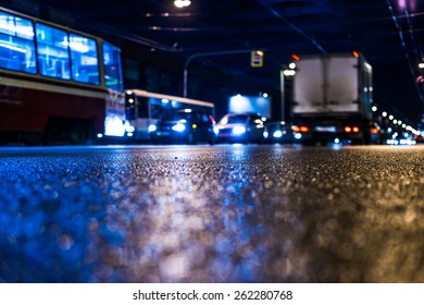 Night City After Rain, The Road On Which The Car Ride In The Traffic Jam. View From Ground Level, In Blue Tones