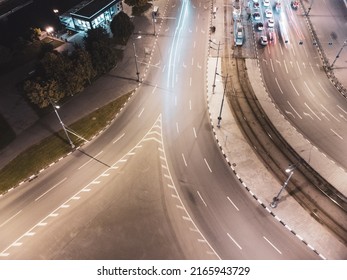 Night City Center Crossroad Transport Traffic. Aerial Look Down View On Cars Driving With Lights Illumination. Downtown Streets In Kharkiv, Ukraine