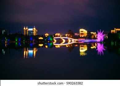 Night City, Park In The Hunchun, China. Reflection In The Water.