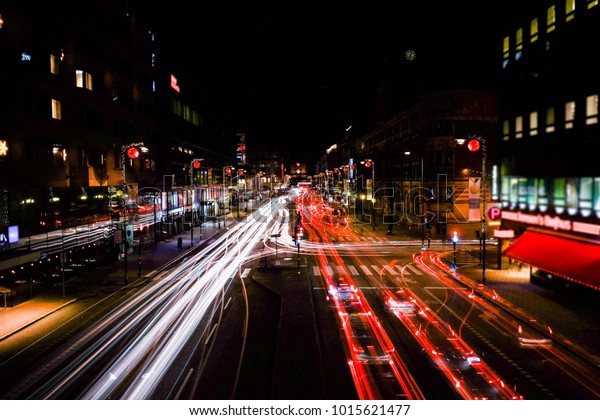 Night city\
road with light print in Stockholm.Cars moving fast and leave a\
print after them.City lights.Long\
exposure
