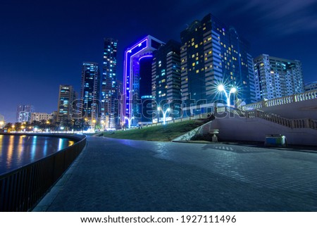 Night City shot with buildings and a bridge 