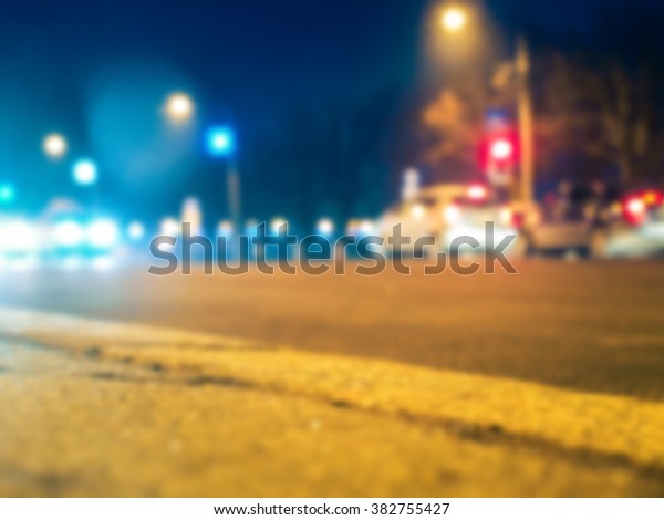 Night city street with cars and traffic\
lights blur background, bokeh background. Riga, Latvia - evening\
city cars and blur\
background.