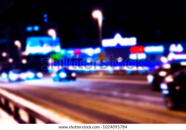 Night city view in blur. City Speed Traffic blurry\
photo. Street life bokeh image. Street view with traffic and cars\
defocused image. Road in big city bokeh image. Blurred Night city.\
Blurry image.