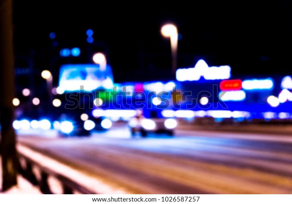 Night city view in blur. City Speed Traffic lights\
blurry photo. Street life bokeh image. Street with traffic and cars\
defocused image. Road in big city bokeh image. Blurred Night city.\
Blurry image.