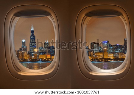 Night cityscape from airplane window, Flight window.