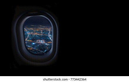 Night Cityscape From Airplane Window In The Sky With Dark Place For Text, Travel And Tourism Concept