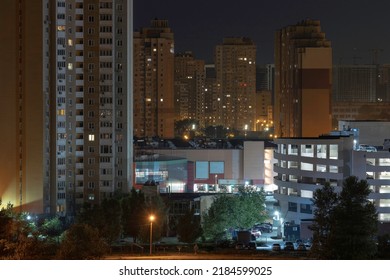 Night Cityscape Of The Big City. Awesome Bright, Multi Colored Light At Curfew On Empty Streets. Apartment Buildings In Bedroom Community, Commuter Town Area. Kyiv In Last Days In July 2022. Ukraine.