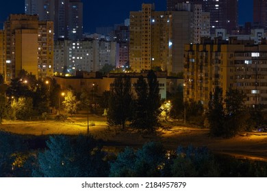 Night Cityscape Of The Big City. Awesome Bright, Multi Colored Light At Curfew On Empty Streets. Apartment Buildings In Bedroom Community, Commuter Town Area. Kyiv In Last Days In July 2022. Ukraine.