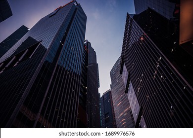 Night Cityscape With City Skyscrapers Buildings Silhouettes Against Blue Sky Of Singapore Asian Financial Center In Perspective View 