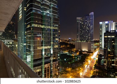 Night cityscape view of the Brickell Avenue area in downtown Miami with office buildings and skyscraper condominiums.