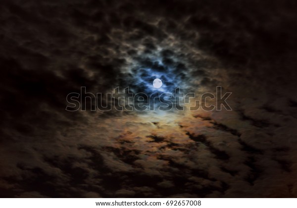 Night cloudy\
sky with full moon on a cloudy\
night