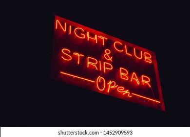 Night Club And Strip Bar Open Red Neon Sign In The Night