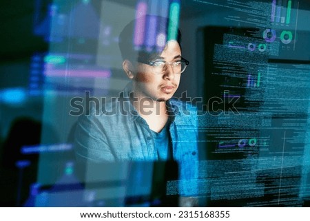 Night, code and hologram with man in office for programming, future and software development. Big data, networking and technology with male developer for cloud computing, programmer and coding