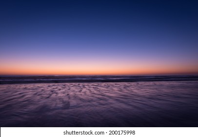 Night colors of the ocean, beach and sky. Long exposure