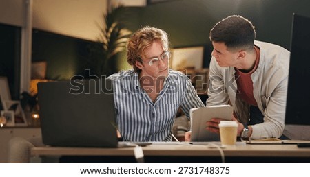Night, creative and team in office with tablet, campaign review or discussion for digital marketing. Late, people and conversation with tech for planning, brainstorming or online advertising insight.