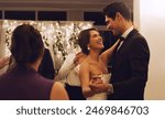 Night, dancing and happy couple with wedding reception for marriage, commitment or celebration. Ceremony, happiness and romantic man with woman bride for relationship, special event or milestone