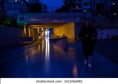 Night, dark. Pedestrian and driveway. Highway underpass. - Powered by Shutterstock