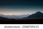 night desert landscape with rocky mountains and sunset sky with clouds in Sharm El Sheikh Egypt