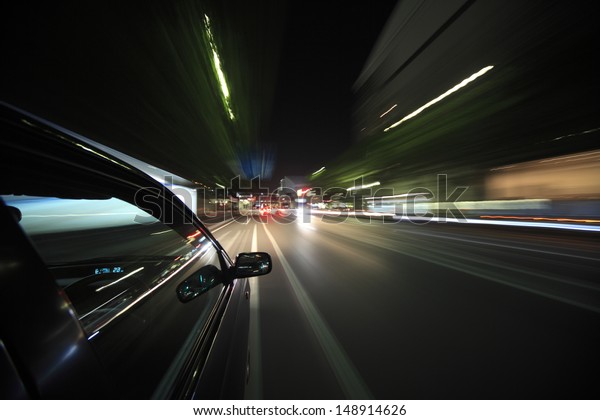Night drive with car in\
motion.