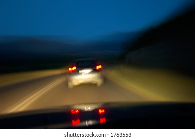 Night drive. Image of a country road ahead at night taken from a driver’s POV