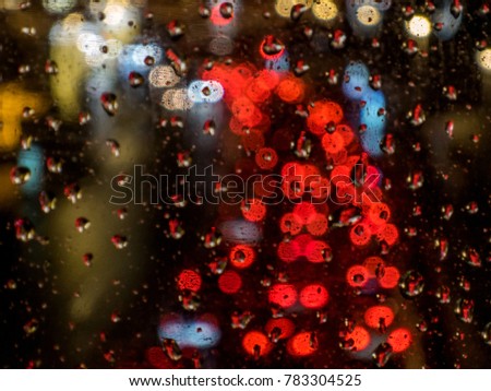 Similar – Drops on the window pane with reflection of the building opposite