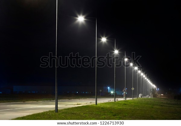 night empty road\
with modern LED street\
lights