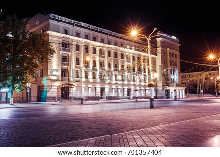 Night empty street in the center of Ufa, Russia with a lighted building with beautiful architecture