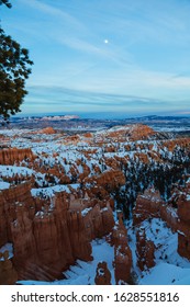 Night Falling Over Bryce Canyon National Park In Winter Covered With Snow