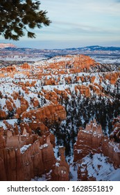 Night Falling Over Bryce Canyon National Park In Winter Covered With Snow