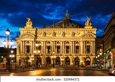 Night front view of the Opera National de Paris. Grand Opera (Opera Garnier) is famous neo-baroque building in Paris. Designed by Charles Garnier in 1875. 