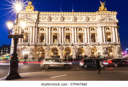 Night front view of the Opera National de Paris. Grand Opera (Opera Garnier) is famous neo-baroque building in Paris. Designed by Charles Garnier in 1875.